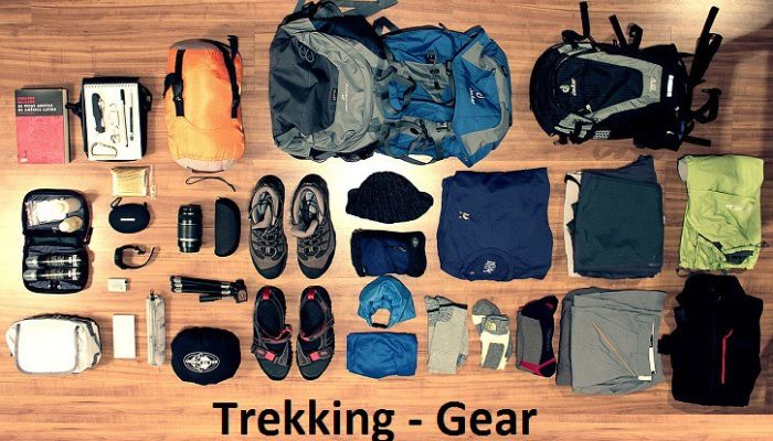 Essential items for a successful trek: backpack, hiking boots, water bottle, map, first aid kit, and compass
