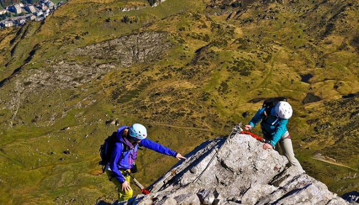 Adventure unfolds: Rock climbing at Rigidalstock, Engelberg, Switzerland, where climbers conquer rugged peaks against a backdrop of breathtaking mountain vistas