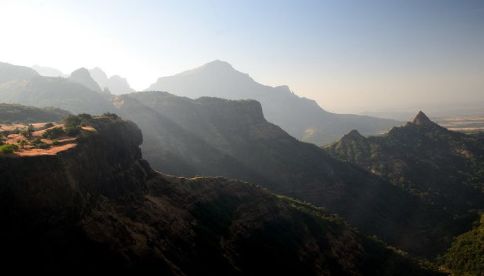 Sandhan Valley Trek - A mesmerizing view of the narrow canyon, steep rocky walls, and a riverbed within Sandhan Valley