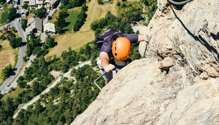 Thrilling Via Ferrata climbing adventure in Engelberg, Switzerland, with breathtaking views of the surrounding alpine landscapes