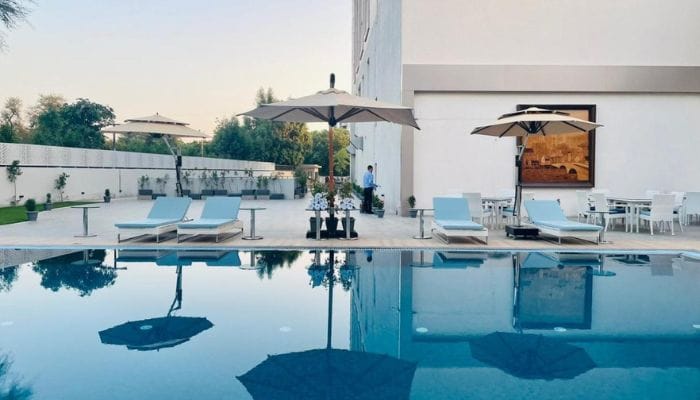 Refreshing swimming pool at Vivanta Ahmedabad SG Highway, a perfect oasis for guests and their furry friends