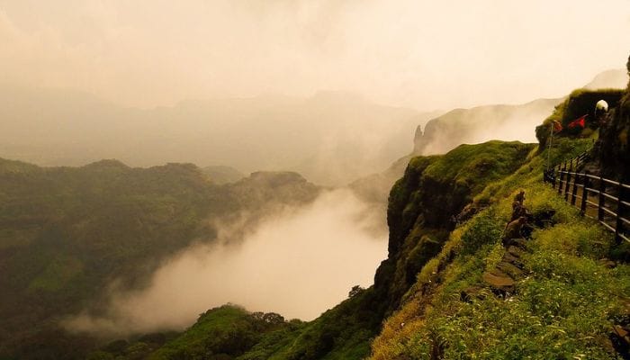 Ratangad Trek in Monsoon - lush greenery, misty trails, and cascading waterfalls, showcasing the allure of the trek during the rainy season