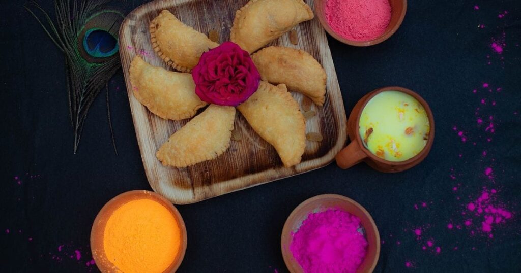 Crescent-shaped pastries filled with coconut and jaggery, known as Kajjikayalu.